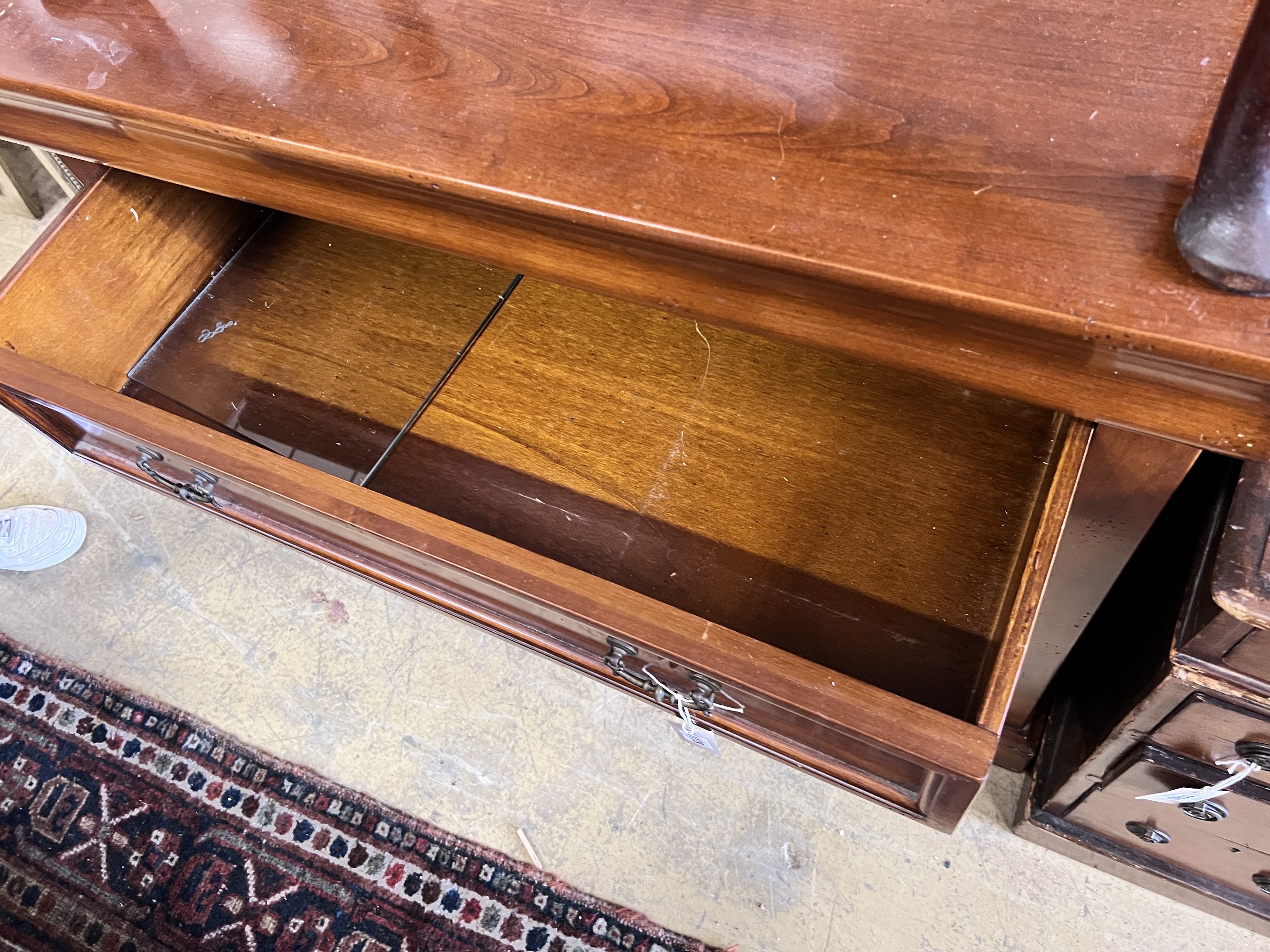 A modern French style mahogany chest of four long drawers, width 105cm